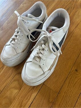 Nike White Sneakers with Black Swoosh